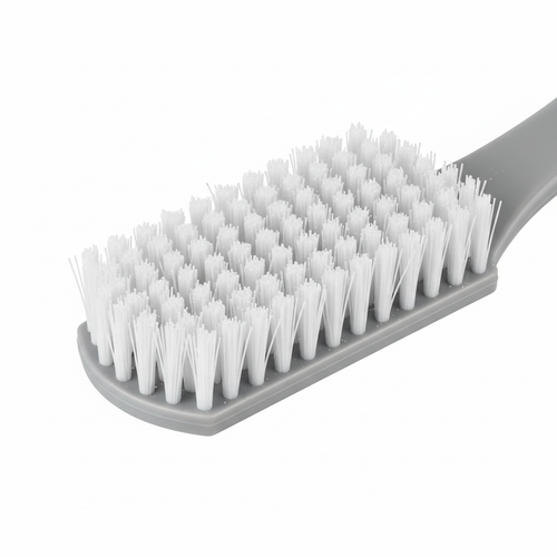 Close-up of narrow stiff bristle head of grout brush